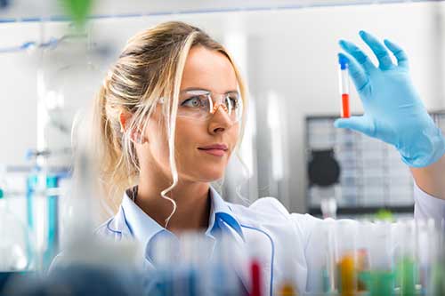 Chemist holding a test tube in a lab