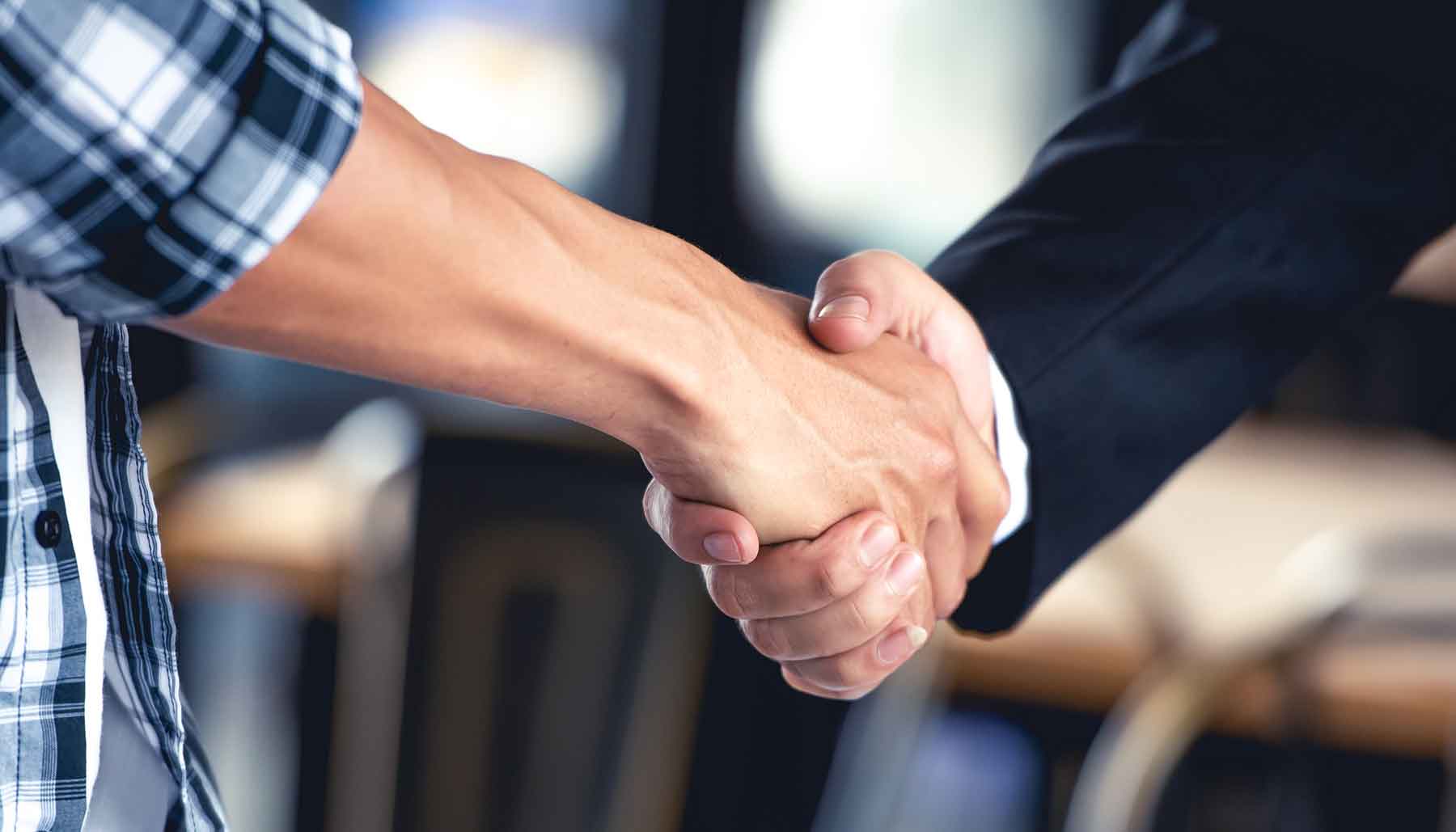 Two people shaking hands