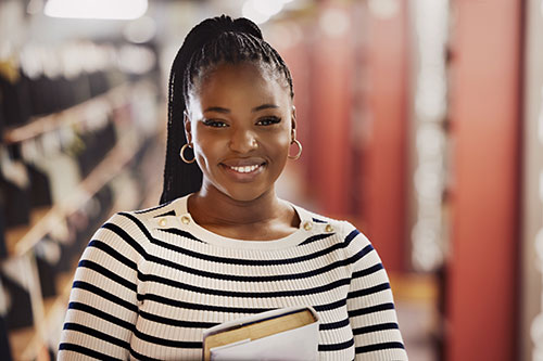 Smiling student in the library