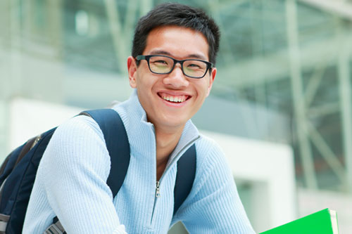 Smiling male asian college student